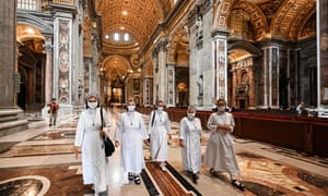 Nuns visit St Peter’s Basilica as it reopened on Monday.