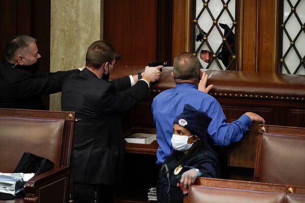 Officers drew their weapons as people tried to break into the House chamber.